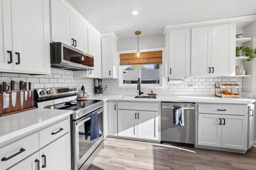 This kitchen has been completly redone by the owners, adding new cabinetry, appliances, backsplash, and flooring