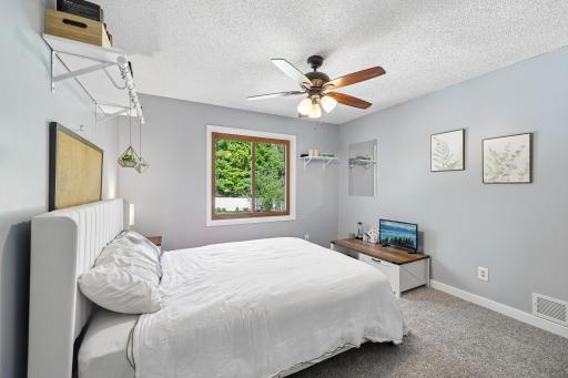 Enjoy views to the private backyard from the primary suit