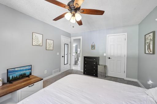 Primary Bedroom with Acess to the Primary Bathroom and Walk-In Closet