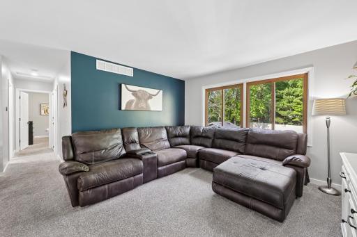 This living space floods with the morning sun from the casement windows outlooking to the backyard
