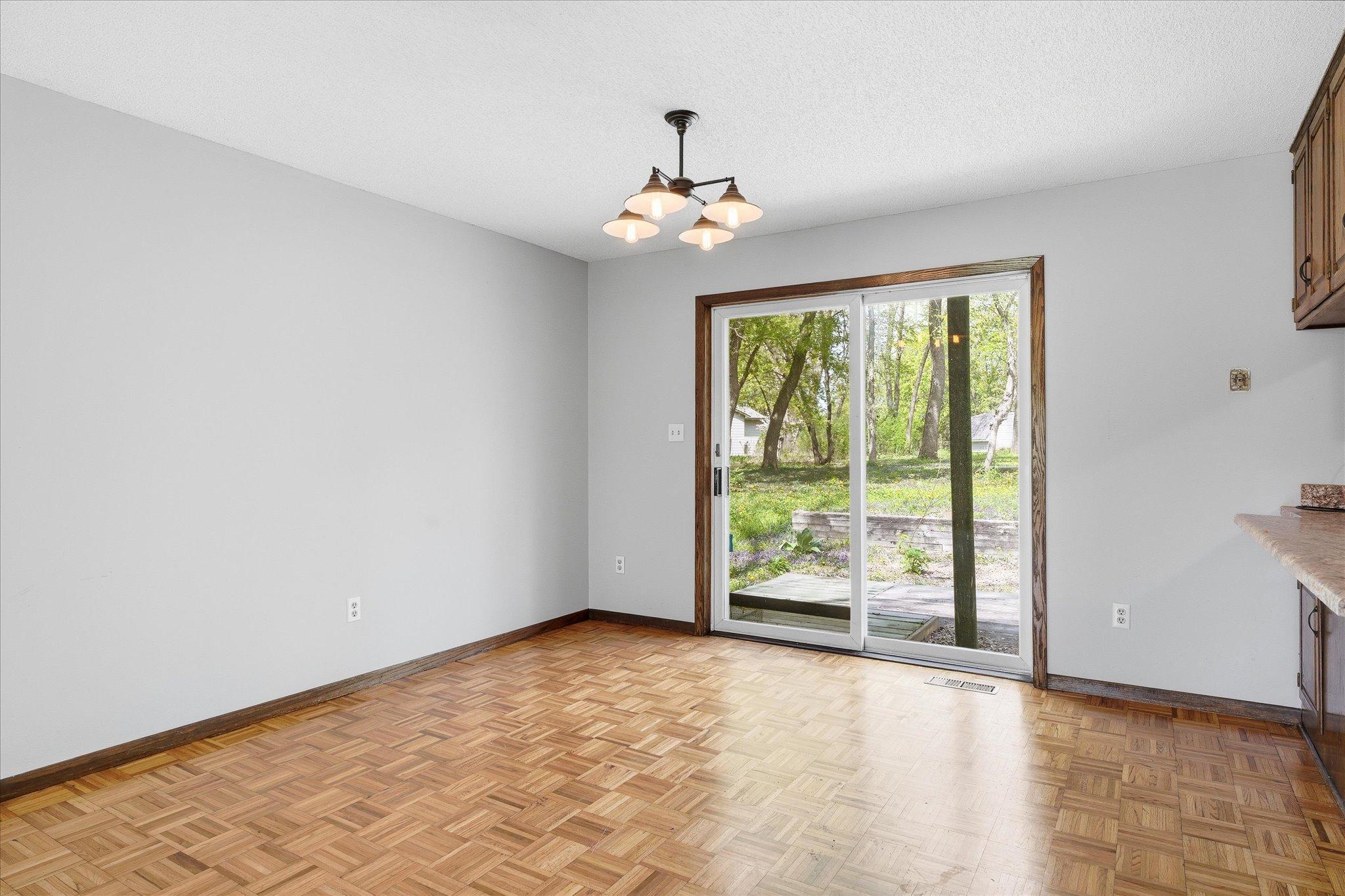 The dining room area walks out to a small deck and overlooks the backyard.