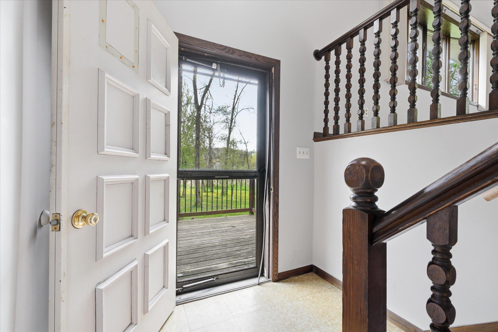 The bright foyer area greets you as you enter the home.