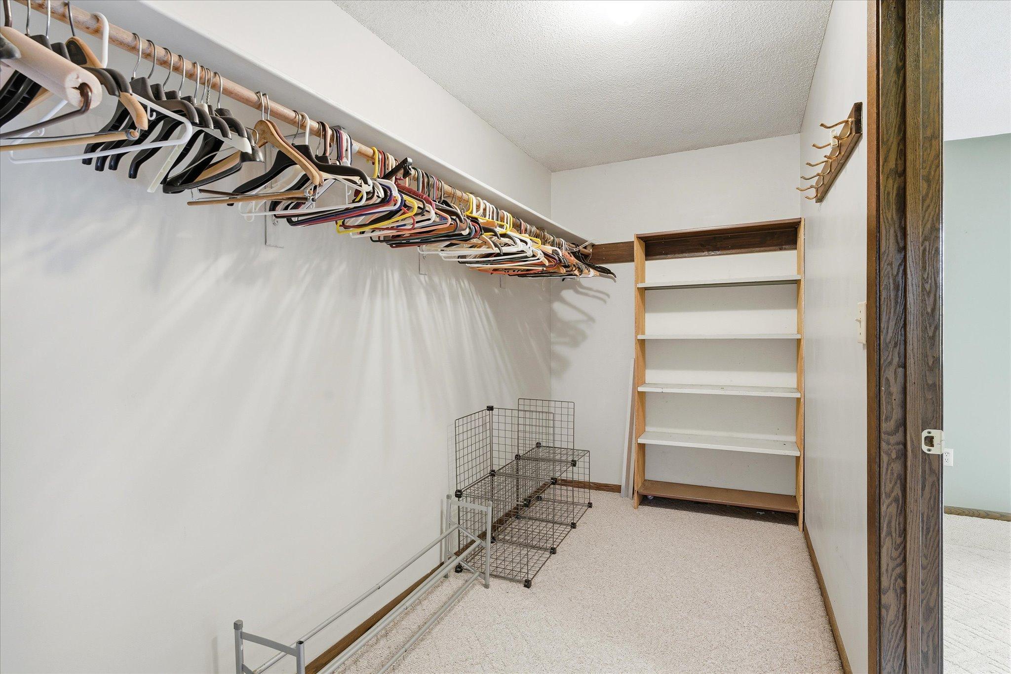 Massive 13x5 primary walk in closet is ideal for all your clothing/storage needs.