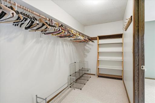 Massive 13x5 primary walk in closet is ideal for all your clothing/storage needs.