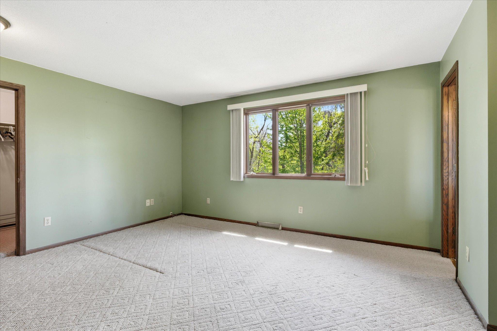 There are 3 bedrooms on the main level of the home and this is the primary bedroom which includes a huge walk in closet and 3/4 bath