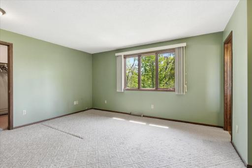There are 3 bedrooms on the main level of the home and this is the primary bedroom which includes a huge walk in closet and 3/4 bath