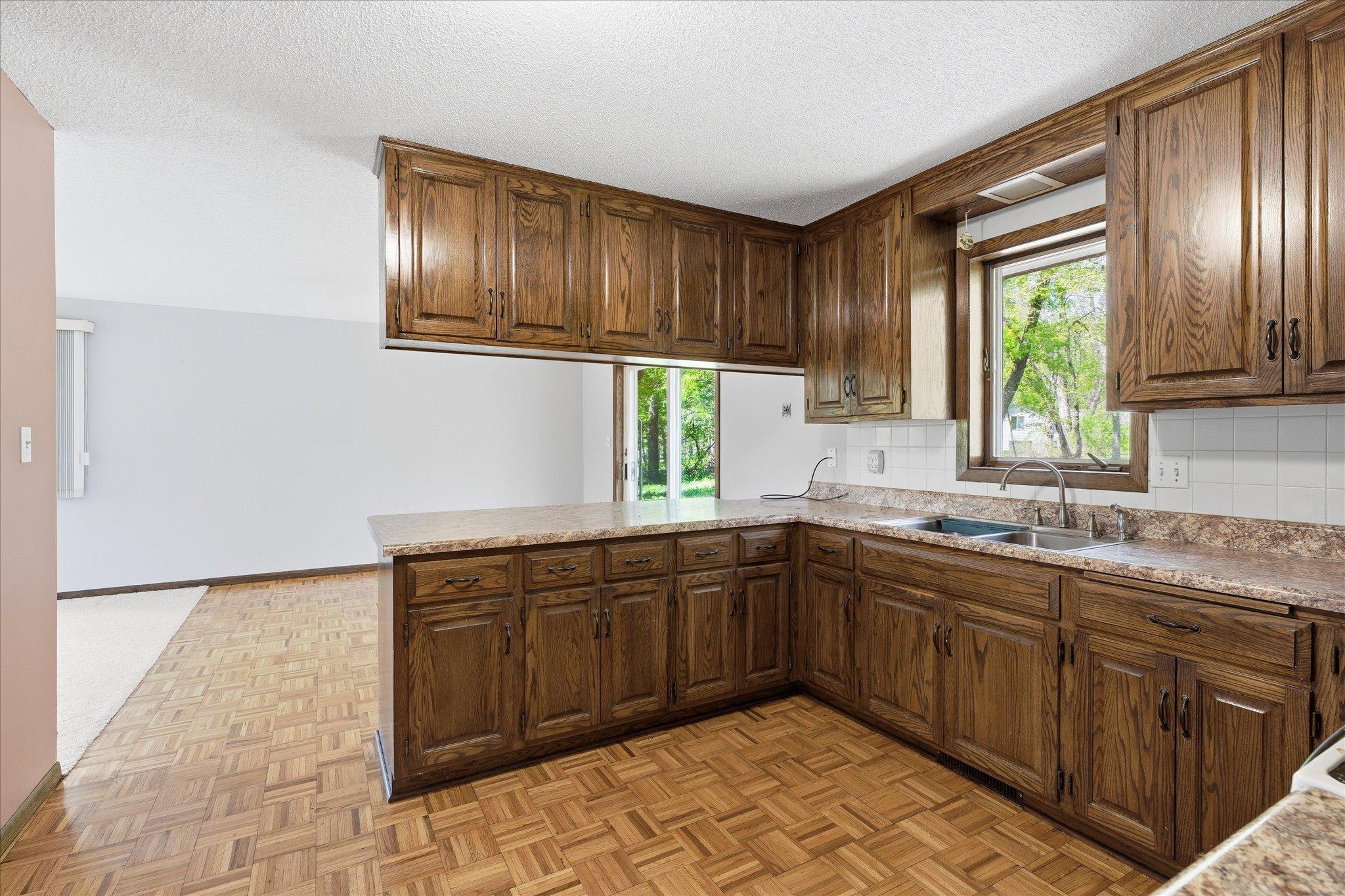 Tons of cabinetry and storage in the large kitchen area.