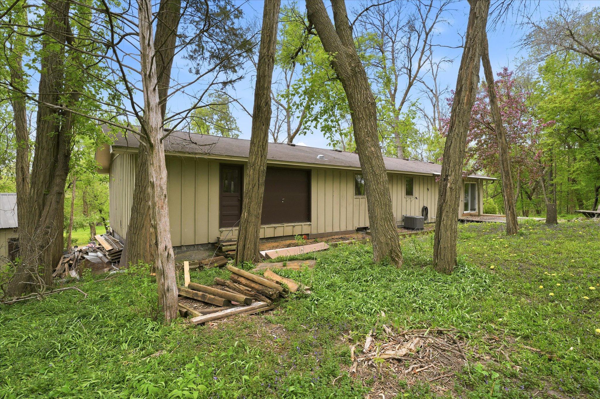 The area in the picture of the brown doors is the entrance to the storage area above the garage complete with a garage door and service door.