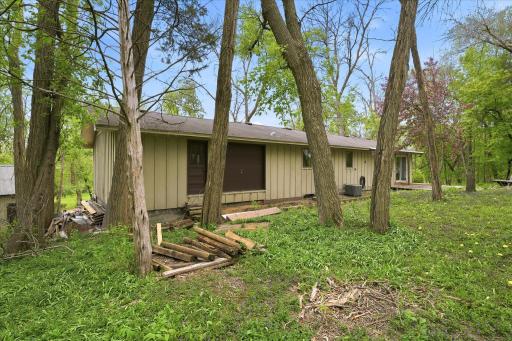 The area in the picture of the brown doors is the entrance to the storage area above the garage complete with a garage door and service door.