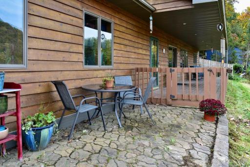 Patio space off the front porch, ready for all your gardening prep or to enjoy a quick BBQ