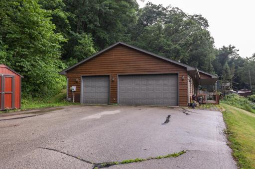 Three-car heated garage and storage shed