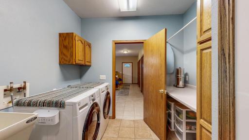 Folding table and more storage behind the door. Plenty of space in this room, well laid out!