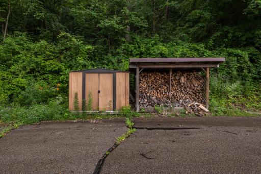 Second shed, comes with the home. Wood is separate and may be negotiable.