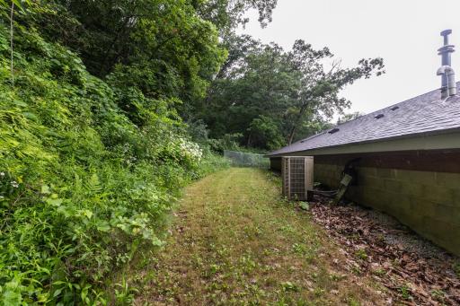 View of the backyard. New roof and skylight window in the back half 2025, new roof in the front half of home, 2019.