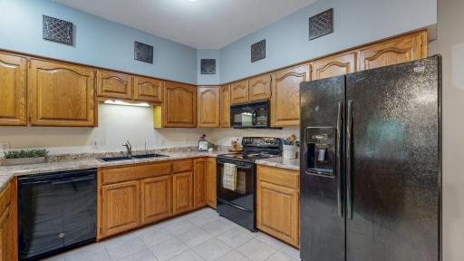 Room to move around in the kitchen. Look at the storage!