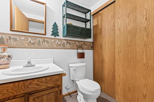 Lower level 1/2 bathroom is plumed for a shower behind the closet doors.