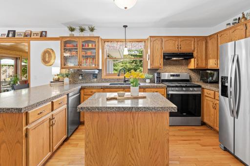 Spacious kitchen with abundant cabinetry, prep space, and ideal flow for gatherings.