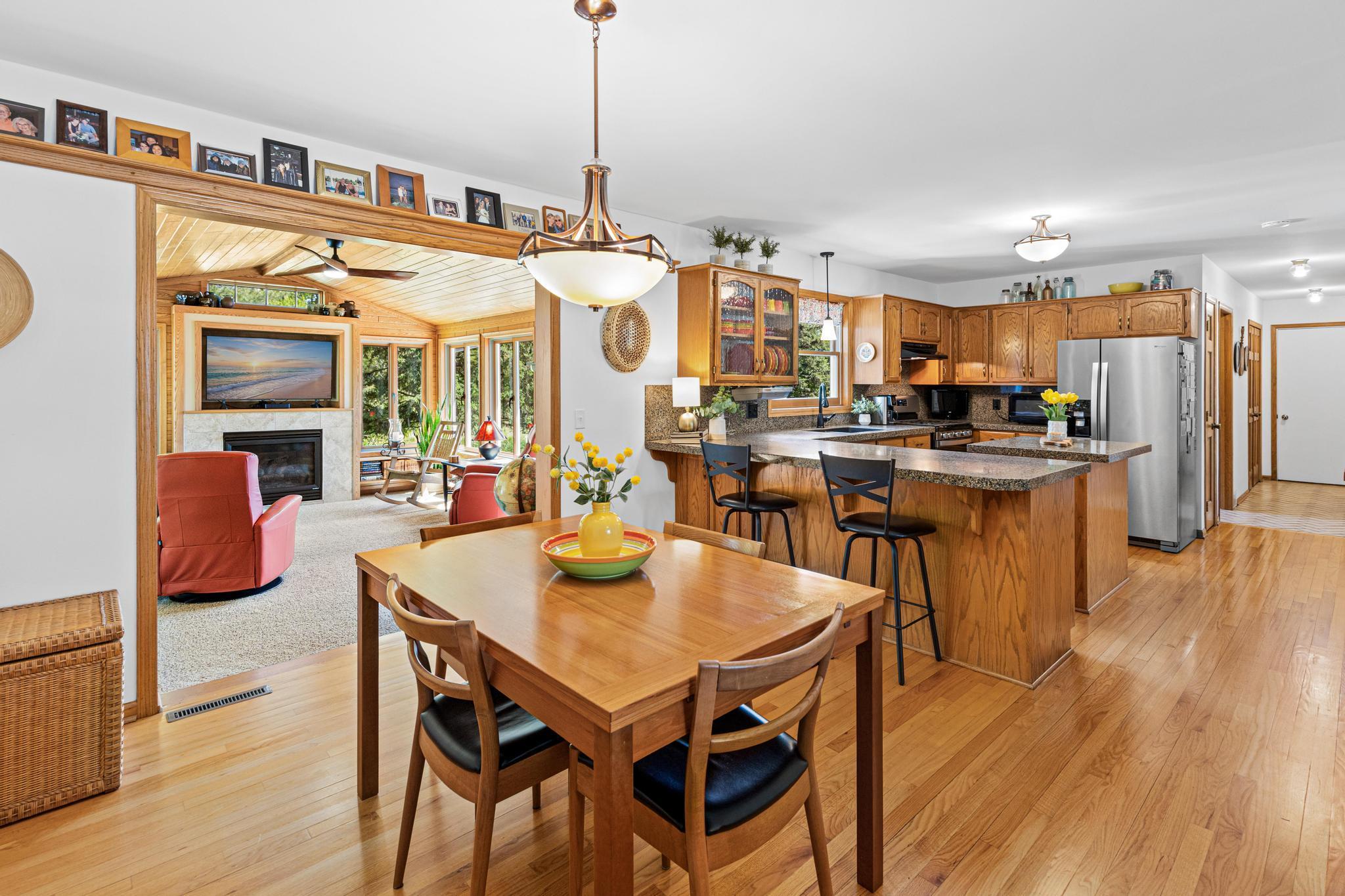 Dining area perfectly positioned between the kitchen and four-season porch, creating an effortless flow for gatherings and entertaining.