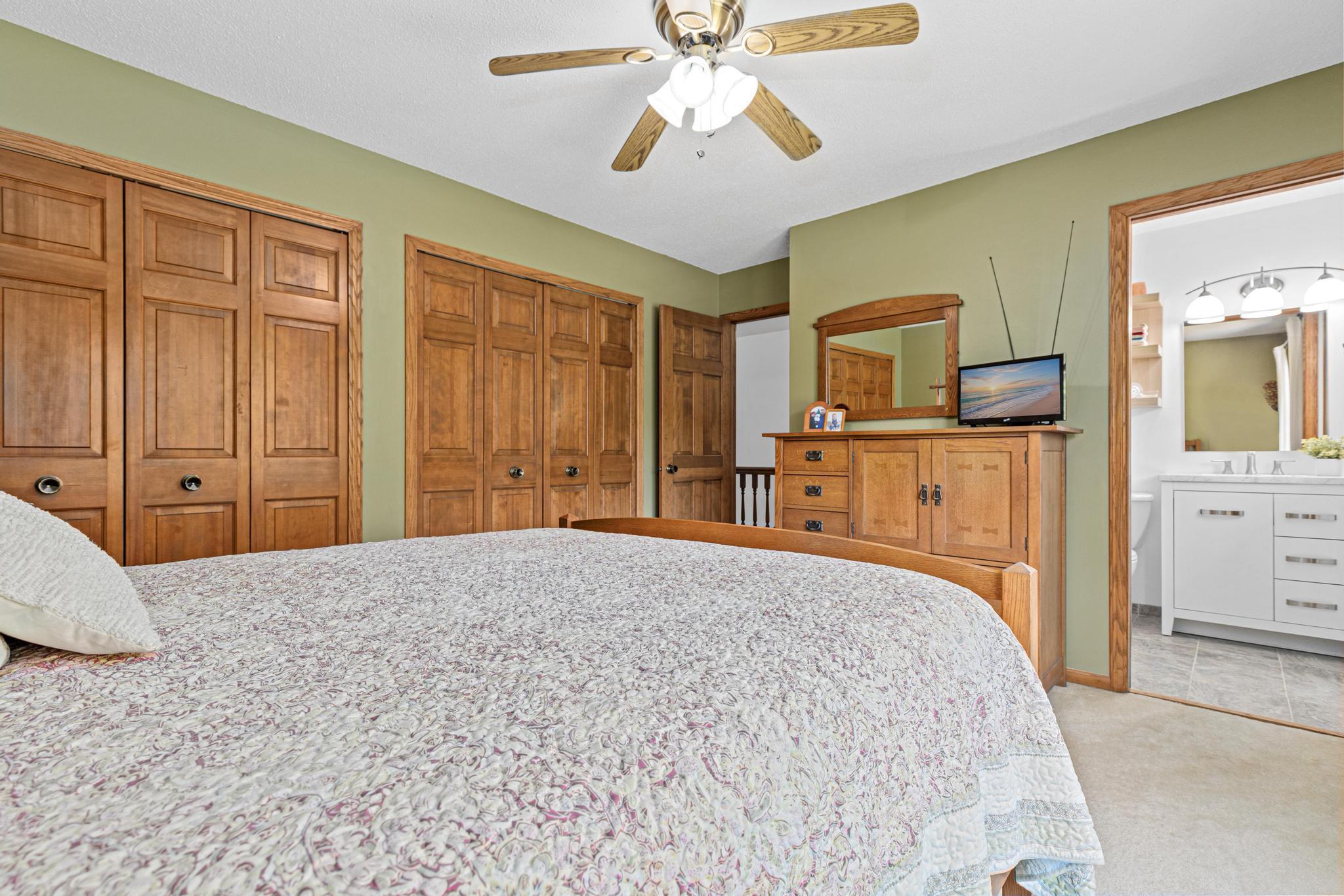 View from the owner's suite looking back towards the door, abundant closet space and 3/4 bathroom.