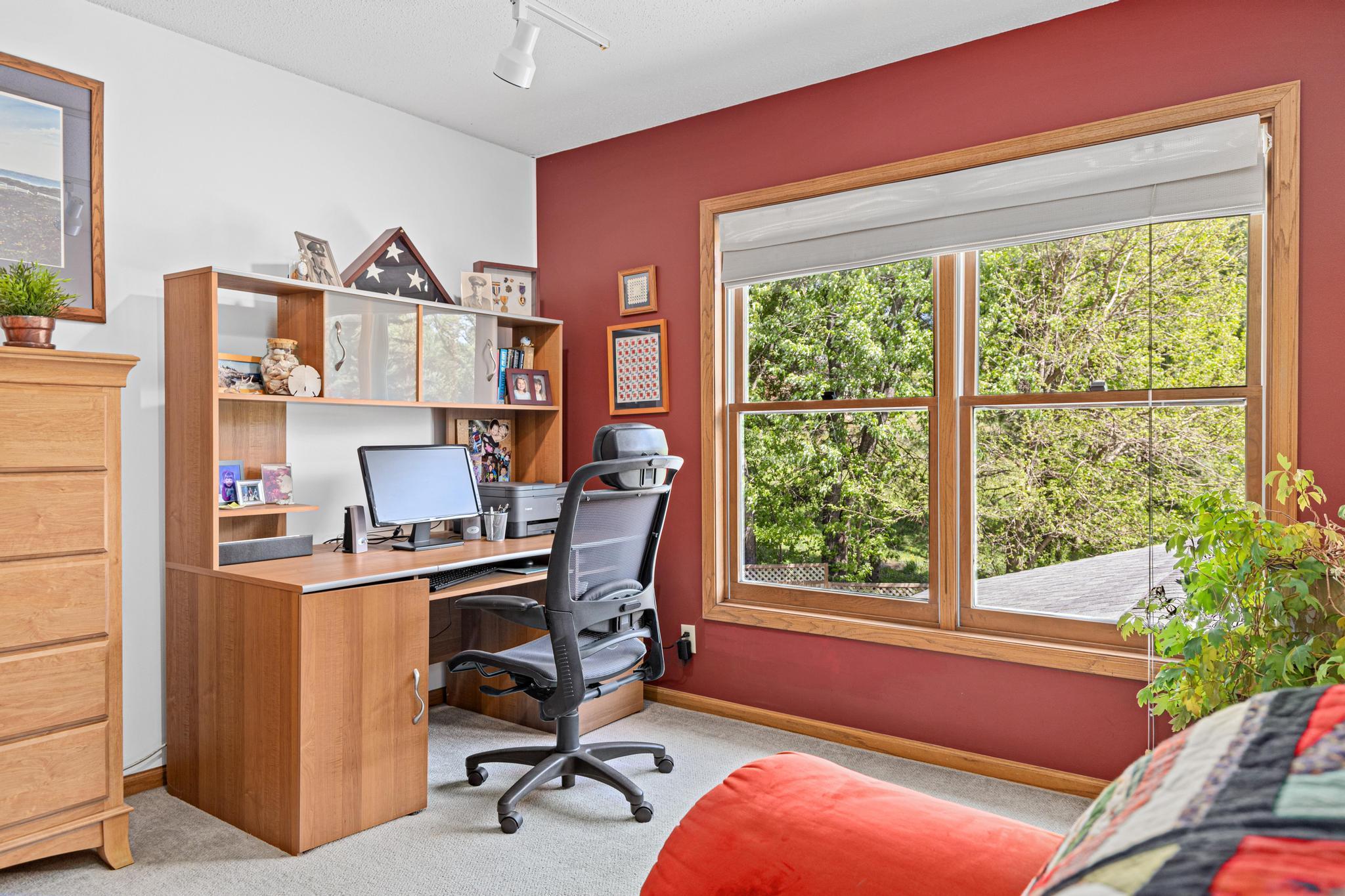 One of four generous upper-level bedrooms offer space and flexibility for family and guests.