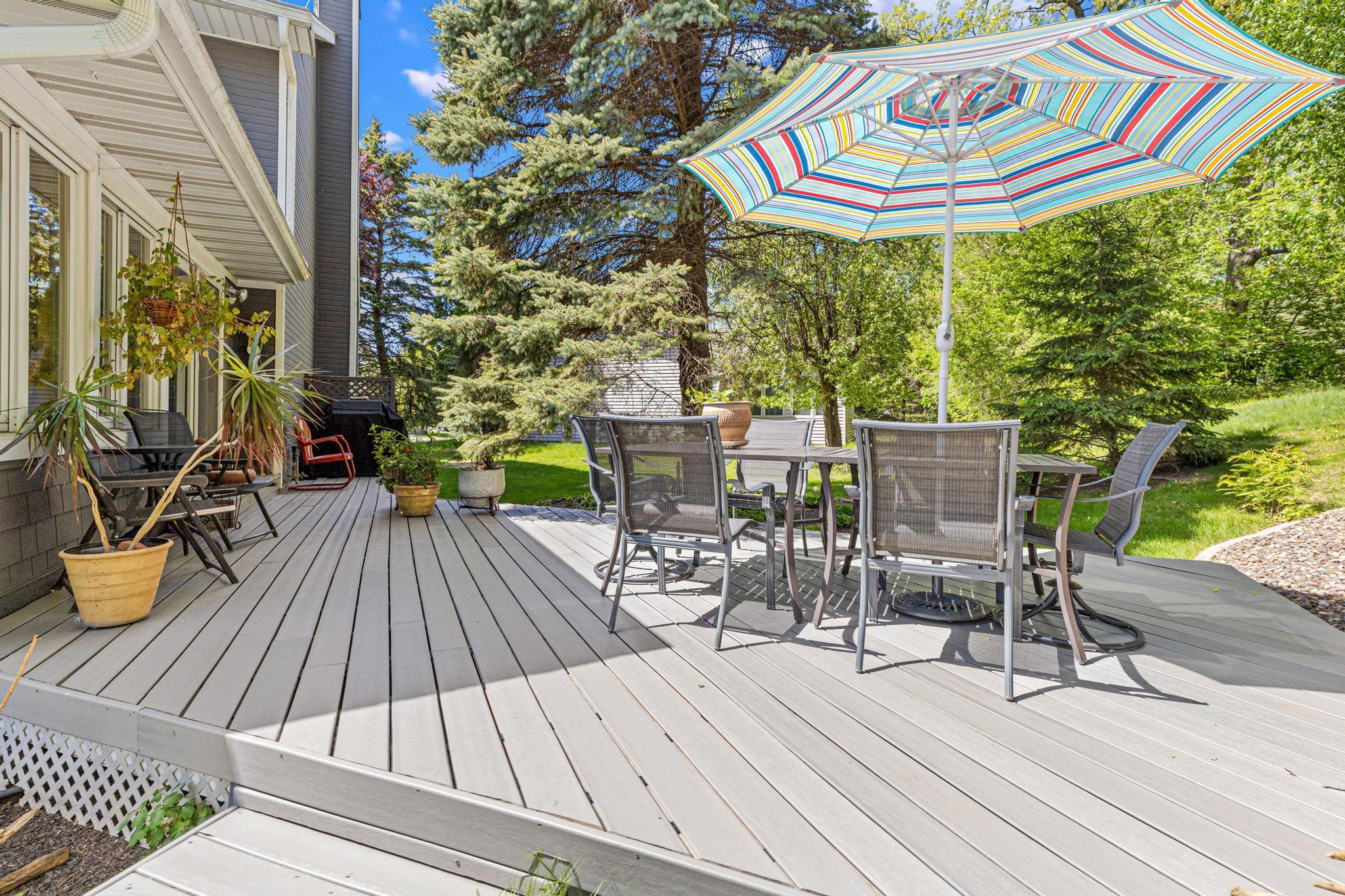 Private deck located off the four season porch with lots of trees for added privacy.