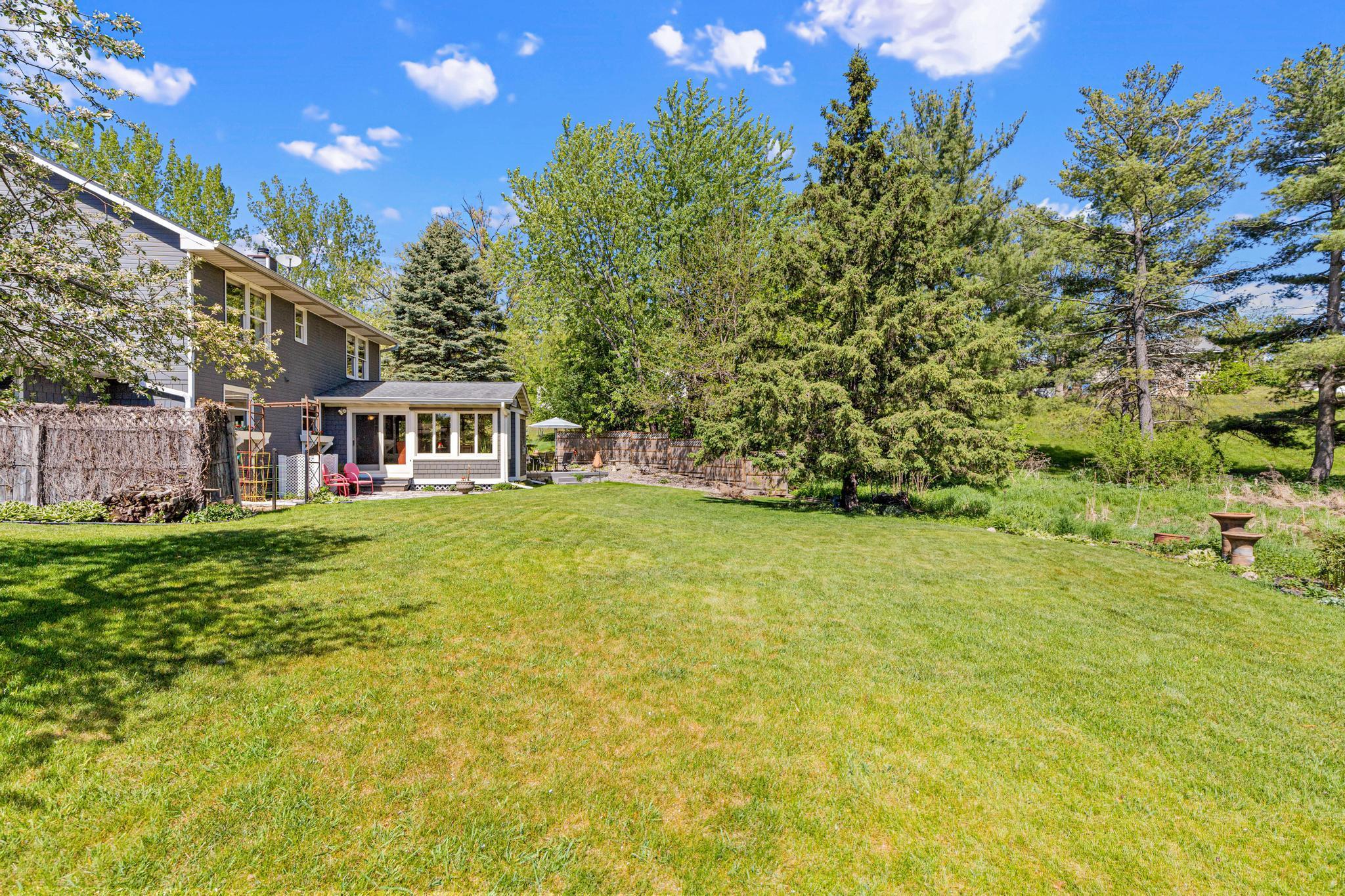 Incredible flat backyard with room to play, garden, or simply enjoy the outdoors.