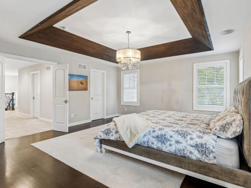 Door on the right is the first closet in the primary suite, door on the left returns you to the hall with the laundry and 3 other bedrooms on the same level