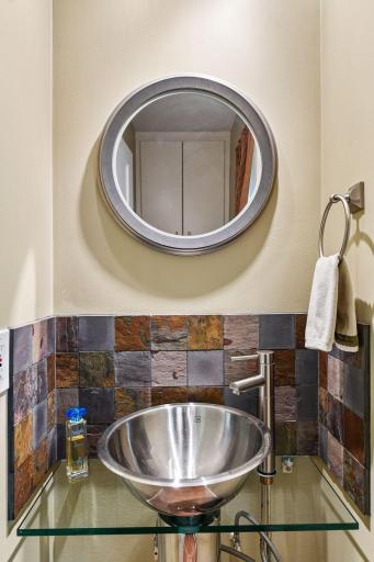 1/2 bath powder room w cabinets near laundry.