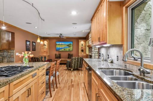 Custom maple cabinets. Hickory flooring. Triple stainless sink.