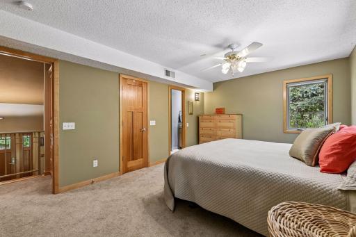 Primary bedroom (king bed) w ensuite bath. GREAT views of private back yard.