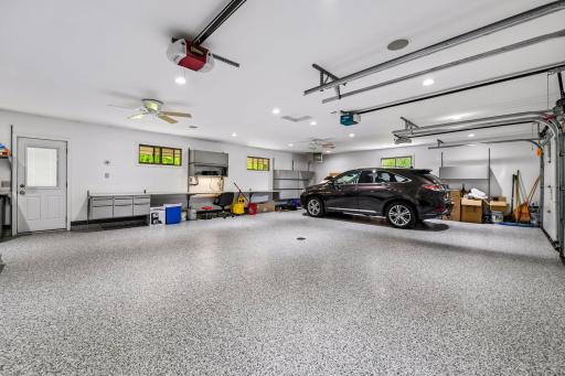 Upper level oversized/heated 3 car garage w ceiling fan, speakers, new epoxy and 9 ft wide doors.