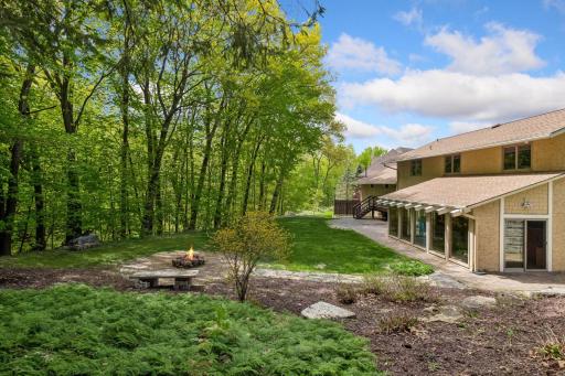 Privacy overlooks woods and Riley Creek. In-ground sprinkler.
