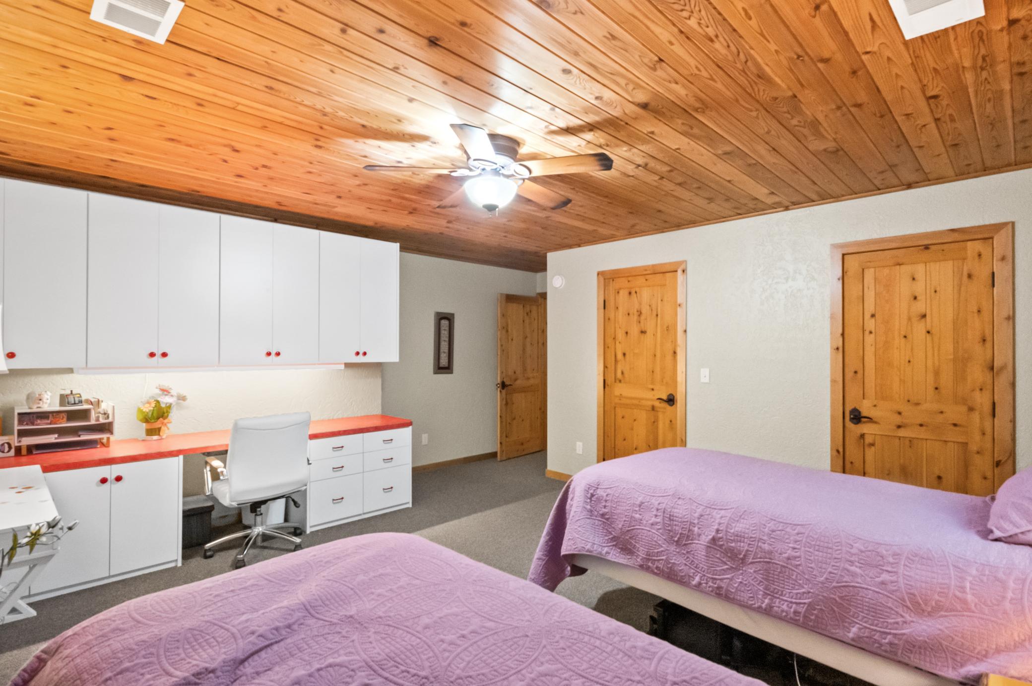 Built-in desk and cabinets and double closet in 3rd bedroom