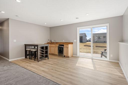 Wet bar with hot & cold water & ample storage for extra kitchen appliances when not in use.