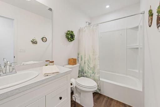 Beautiful main level full bathroom with oversized vanity.