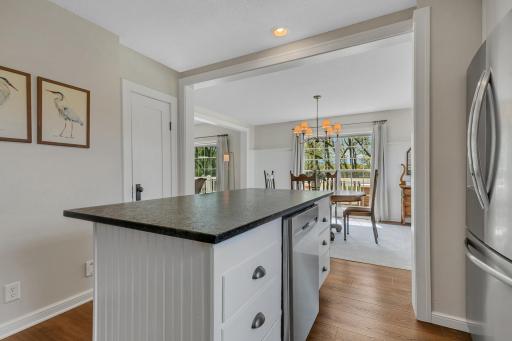 Fantastic open-concept flow from the kitchen island directly into the light-filled dining space, perfect for hosting family and friends