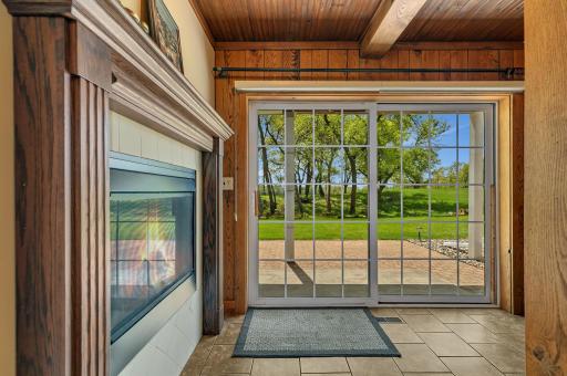 "Incredible indoor-outdoor flow! This versatile lower-level living space features a massive sliding glass door that steps directly out to a beautiful brick paver patio, perfect for grilling and entertaining in the expansive backyard.