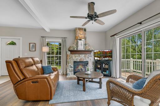 Sun-drenched open layout featuring large windows, beautiful backyard views