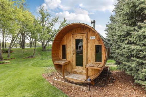 The ultimate backyard amenityâthis classic wood-fired barrel sauna offers a luxurious spa experience right at home.