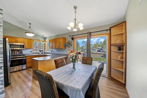 Open concept, kitchen and dining area with breakfast bar are great for entertaining. Walk through the patio doors and onto your deck for more entertaining space.