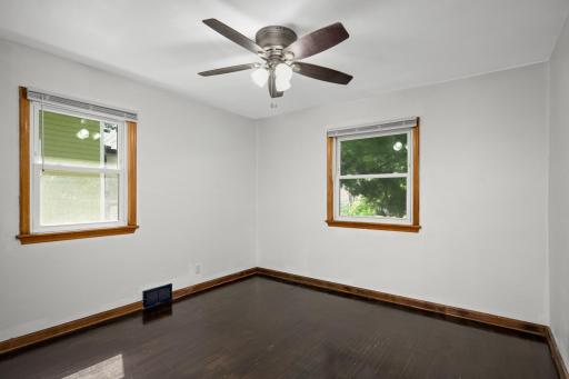 Multiple bedroom windows provide natural light
