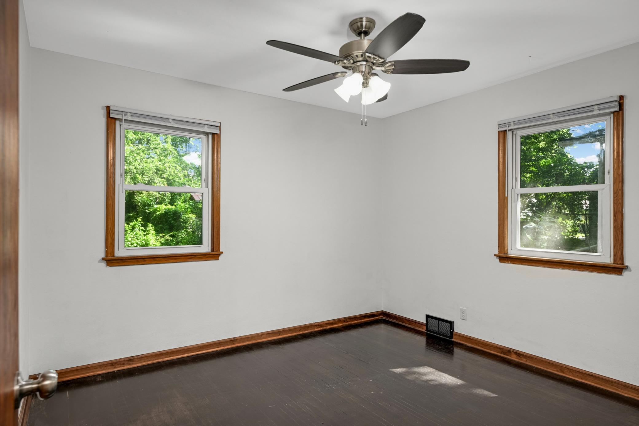 Bright main-level bedroom with hardwood floors