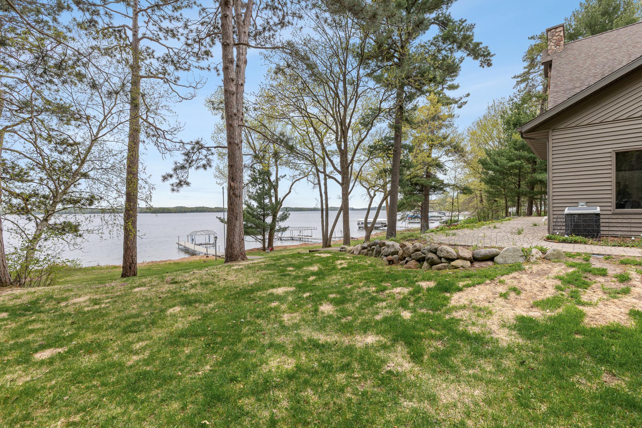 Back yard and Paver patio over looking lake and 2 docks