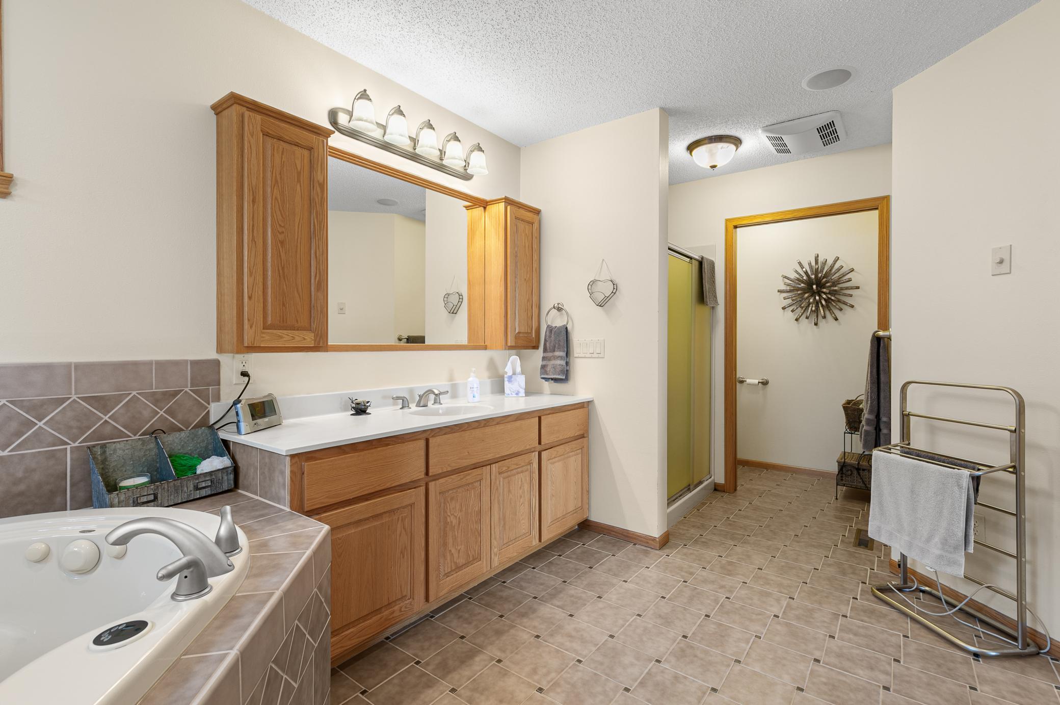 Owner suite full Bath, soaker tub, walk-in shower, and separated toilet area