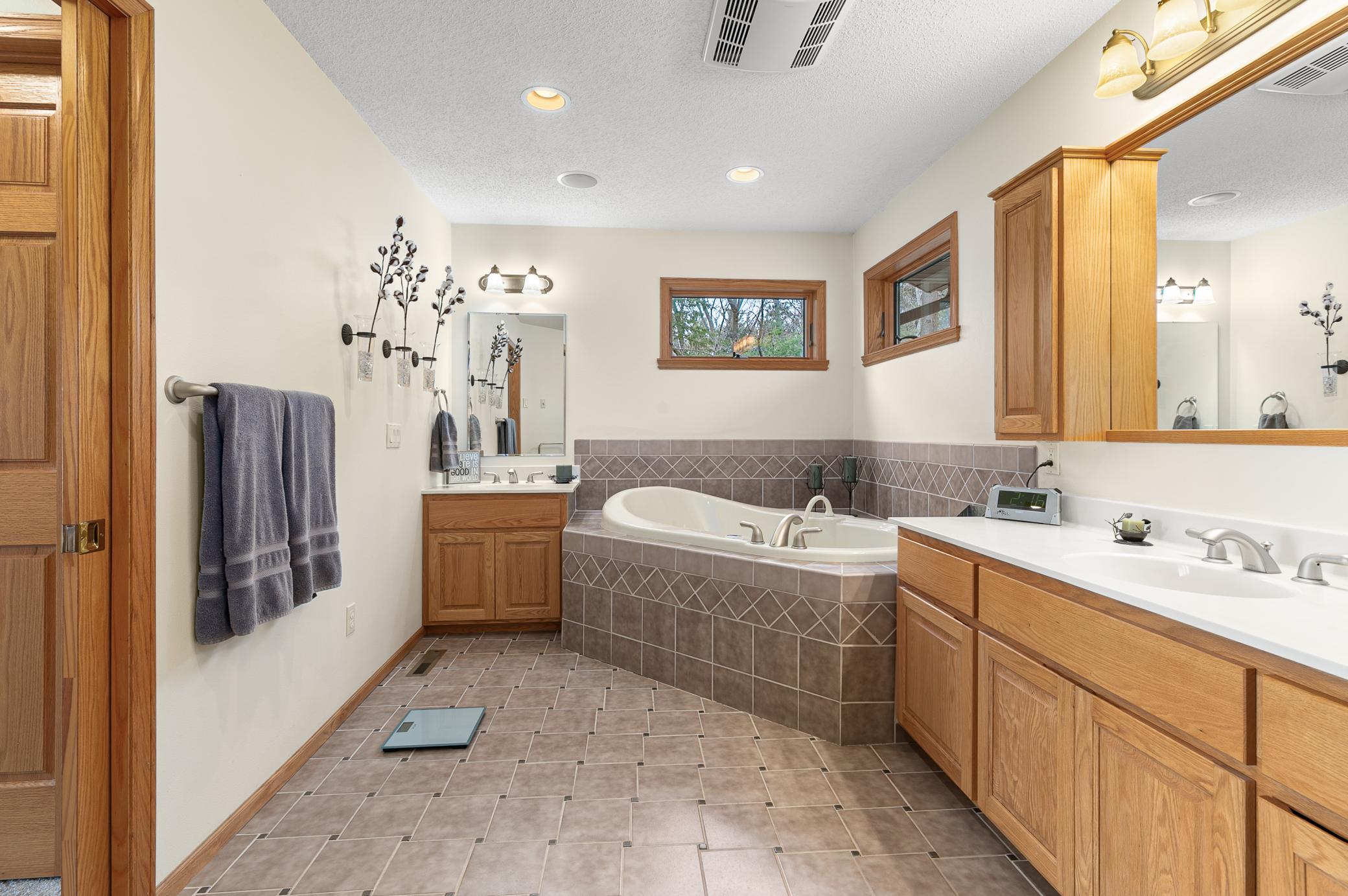 Soaker tub and separate vanities