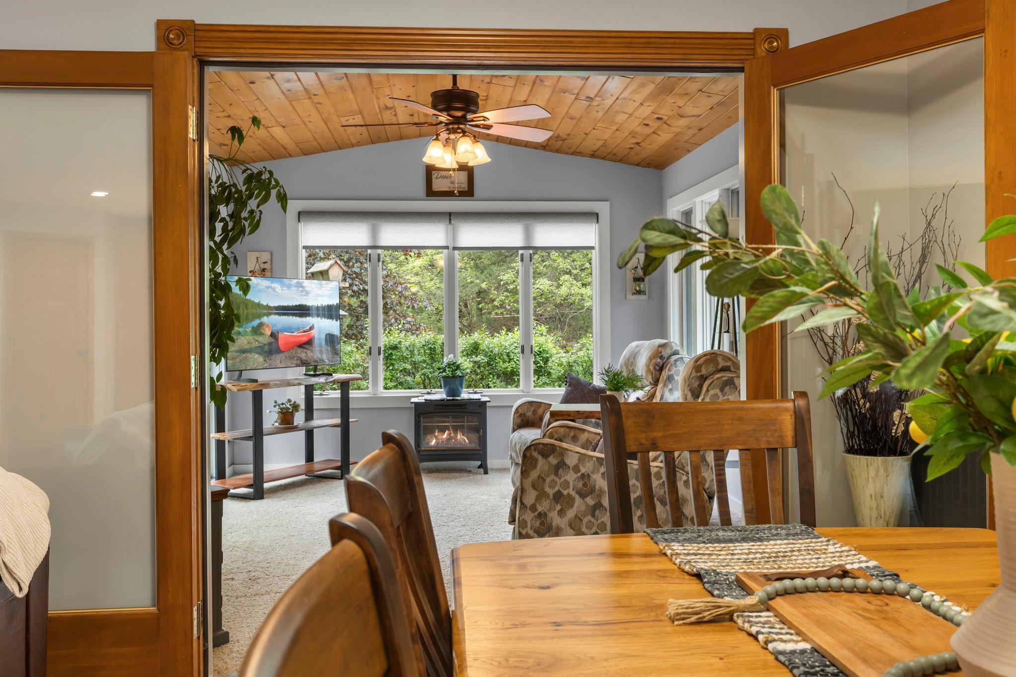 Main floor sun room looking into backyard