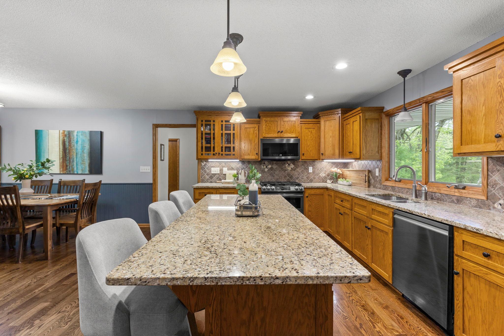 Granite tops, real stone backsplash, SS appliances