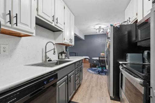 Updated kitchen with Corian Counters & SS Appliances