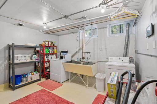Lower Level Laundry Room with coin-op washer and dryer