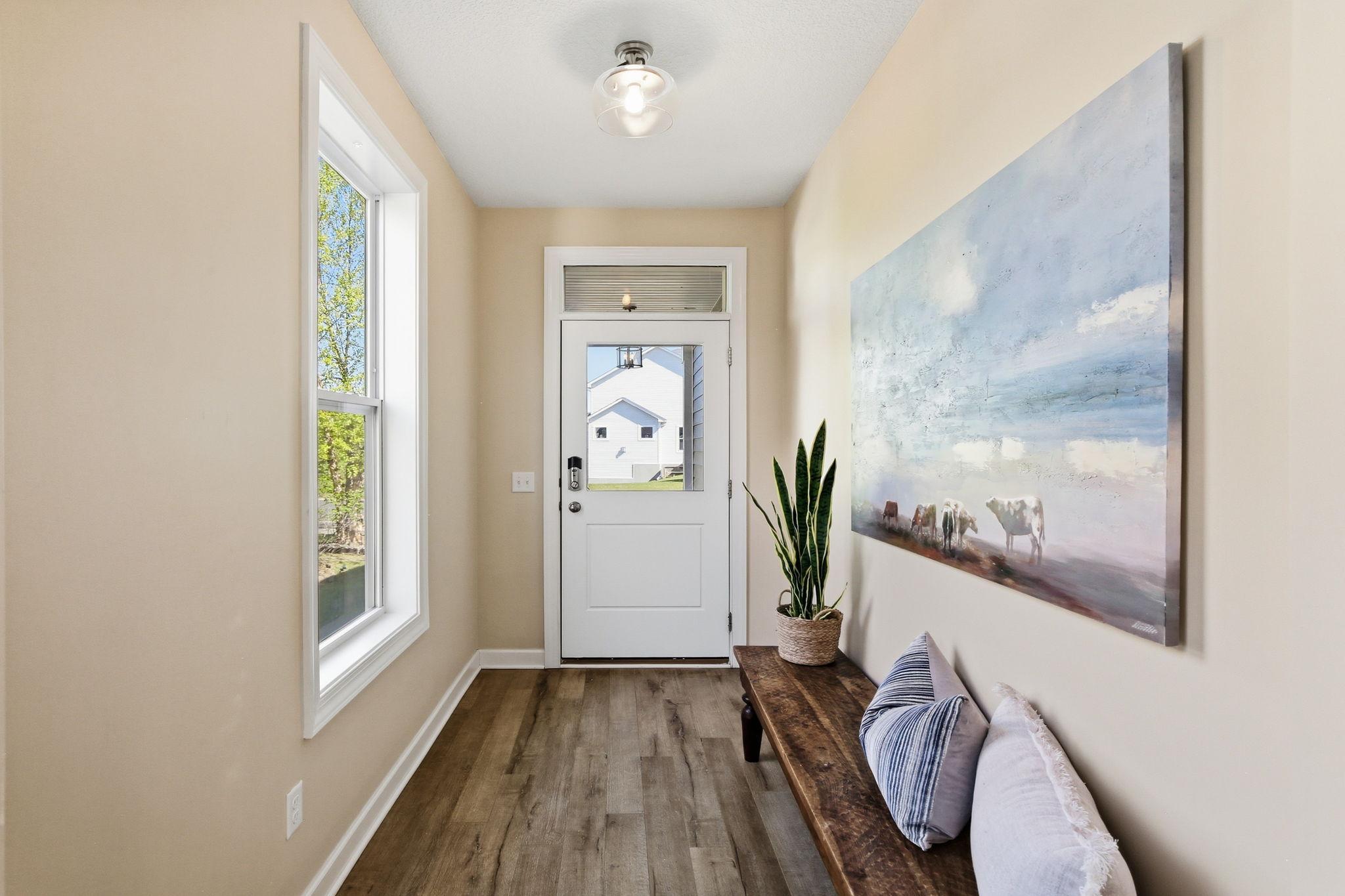 Large front foyer with 1/2 glass front door and window
